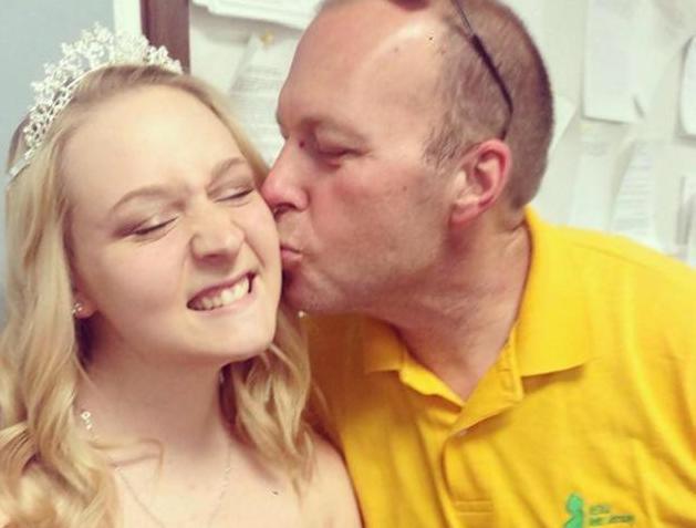 Scott Danielson kisses his daughter Alycia who was crowned'Miss Andover Borough a couple years ago. File