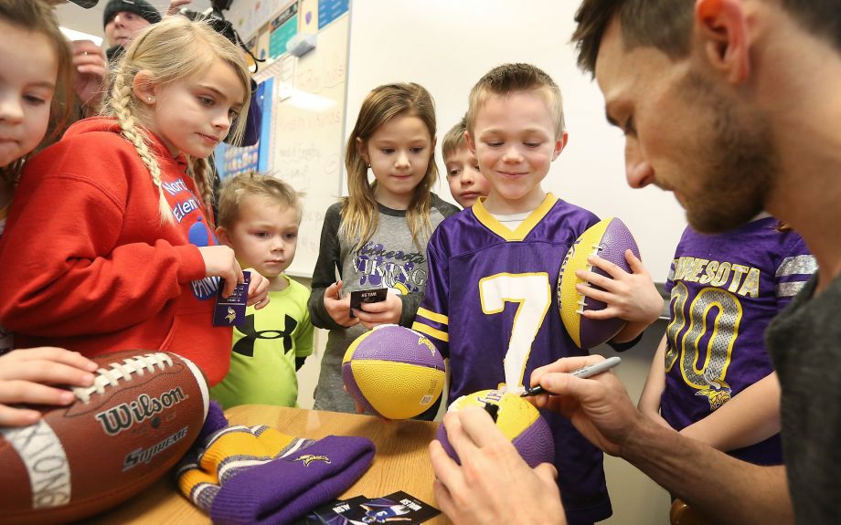 Vikings kicker Blair Walsh signs autographs for first graders during a visit to Northpoint Elementary School in Blaine Minn. on Thursday