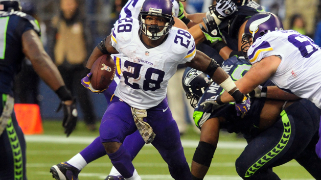 SEATTLE WA- NOVEMBER 17 Running back Adrian Peterson #28 of the Minnesota Vikings runs with the ball during the third quarter of the game against the Seattle Seahawks at Century Link Field