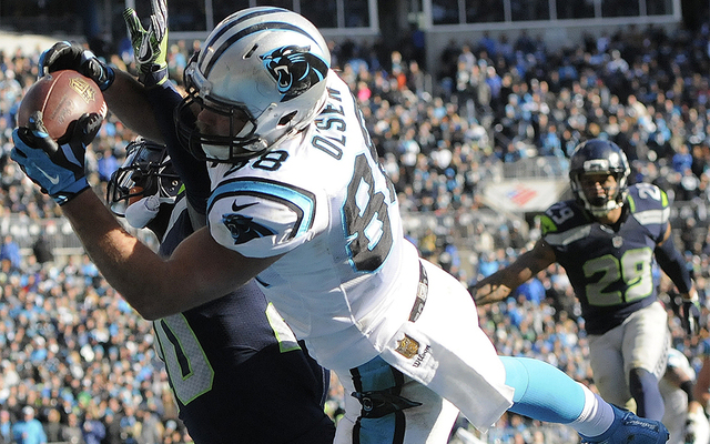 ASSOCIATED PRESS           Carolina Panthers tight end Greg Olsen makes a touchdown catch against Seattle Seahawks cornerback Jeremy Lane during the first half of an NFL divisional playoff football game on Sunday in Charlot