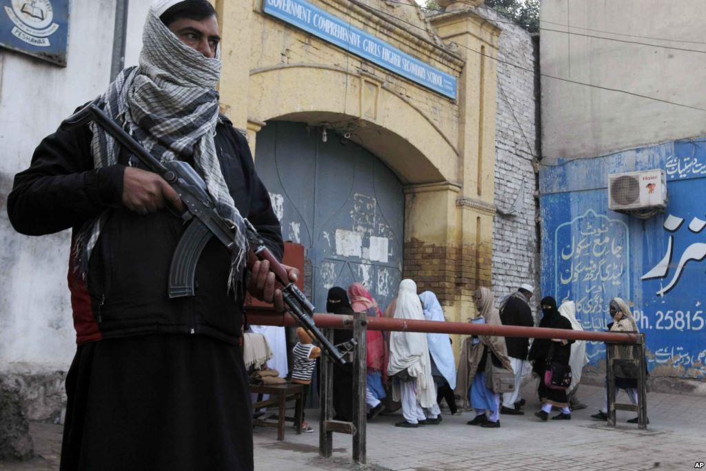 Security guards stand alert around schools and colleges following an attack on Bacha Khan University in Peshawar Pakistan Jan. 21 2016