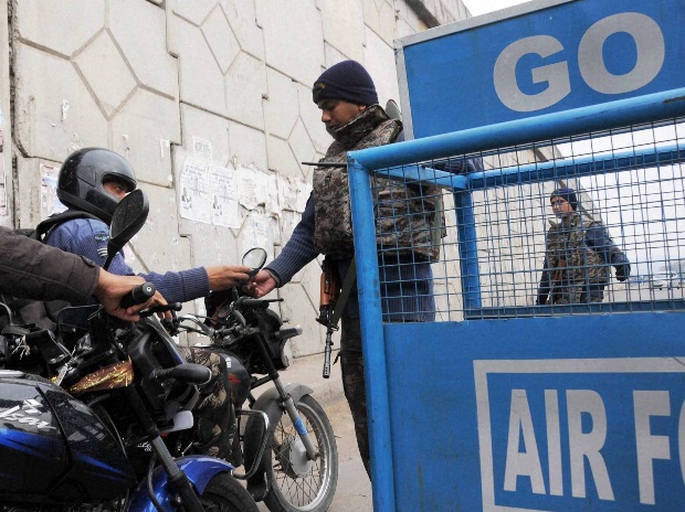 Security men check IAF employees arriving at Pathankot Air Force base