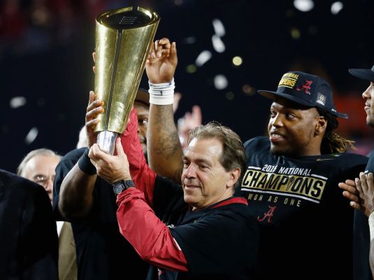 Alabama head coach Nick Saban celebrates by hoisting