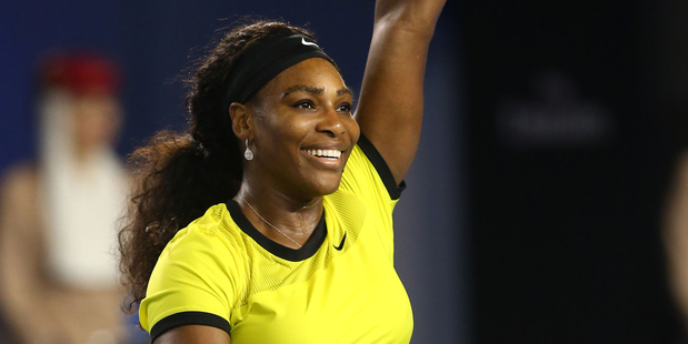 Serena Williams celebrates winning her semifinal match against Agnieszka Radwanska