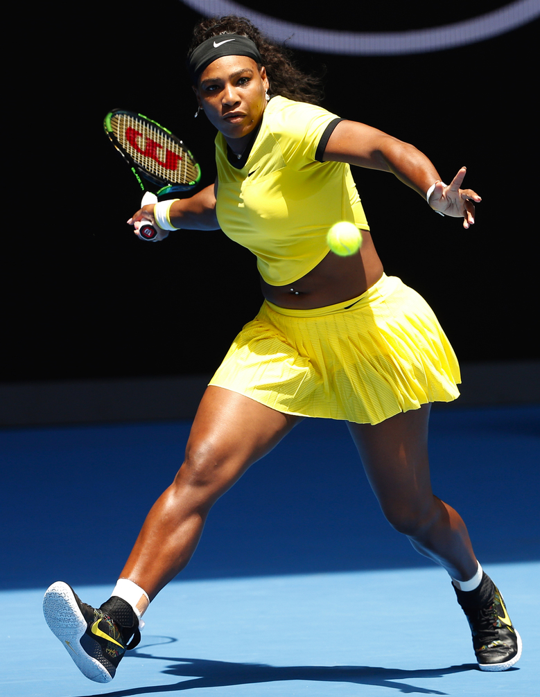 Serena Williams makes a forehand return to Camila Giorgi during their first-round Australian Open match