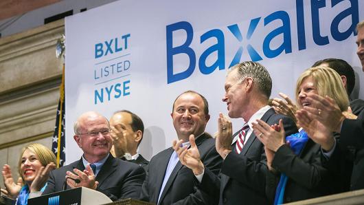 Ludwig Hantson, Chief Executive Officer of Baxalta celebrates the company's IPO after ringing the opening bell above the floor of the New York Stock