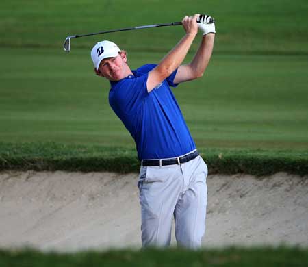 Brandt Snedeker plays a shot from a bunker on the 13th hole during the second round of the Sony Open In Hawaii at Waialae Country Club on Saturday in Honolulu Hawaii. AFP