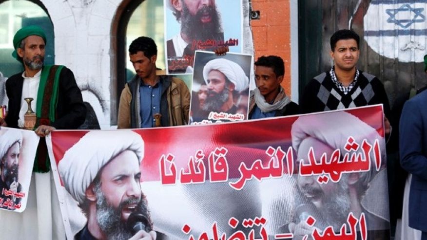 Jan. 7 2016 Shiite rebels known as Houthis hold posters of late Shiite cleric Nimr al-Nimr who was executed in Saudi Arabia during an anti Saudi protest outside the Saudi embassy in Sanaa Yemen