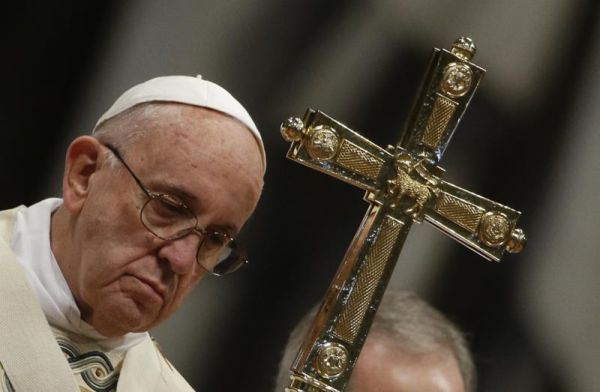 Pope Francis holds the pastoral staff during