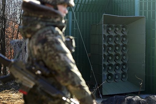 A South Korean soldier stands near the loudspeakers near the border area between South Korea and North Korea in Yeoncheon South Korea Friday Jan. 8 2016. South Korea responded to North Korea's nuclear test with broadcasts of anti Pyongyang propaga