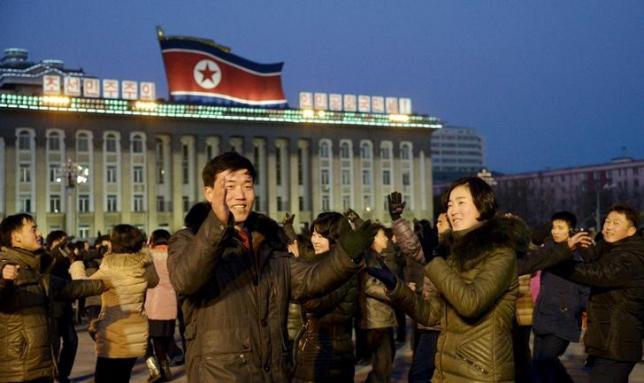 North Koreans dance to celebrate what the country claims was a''successful hydrogen bomb' test at Kim Il Sung square in Pyongyang North Korea in this