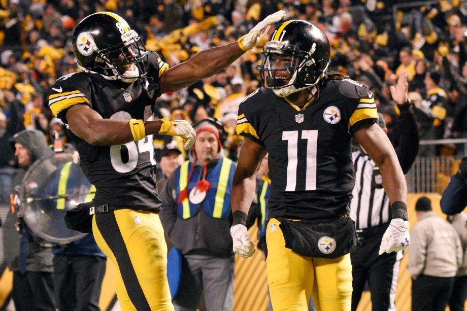 Pittsburgh Steelers wide receiver Markus Wheaton celebrates with wide receiver Antonio Brown after scoring a touchdown during the second half of an NFL football game against the Denver Broncos in Pitts