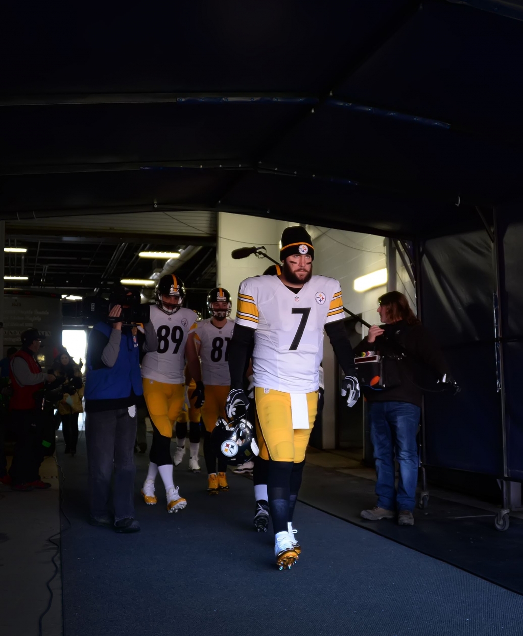 20160117pdSteelersSports01-3 Steelers quarterback Ben Roethlisberger makes his way to the field with a determined look to take on the Broncos at Sports Authority Field at Mile High Denver Colorado