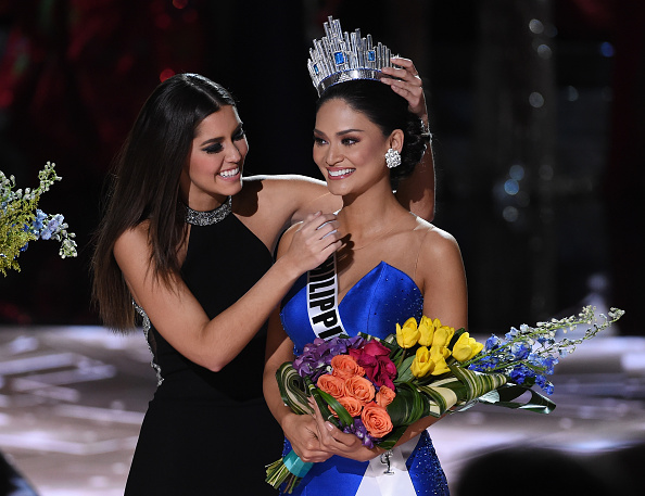 LAS VEGAS NV- DECEMBER 20 Miss Universe 2014 Paulina Vega hugs Miss Philippines 2015 Pia Alonzo Wurtzbach after host Steve Harvey mistakenly named Miss Colombia 2015 Ariadna Gutierrez Arevalo, the new Miss Universe instead of Wurt