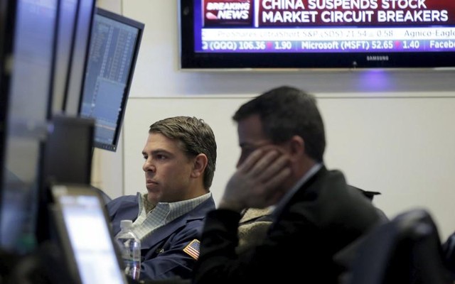 Traders work on the main trading floor of the New York Stock Exchange shortly after the opening bell of the trading session in the Manhattan borough of New York City