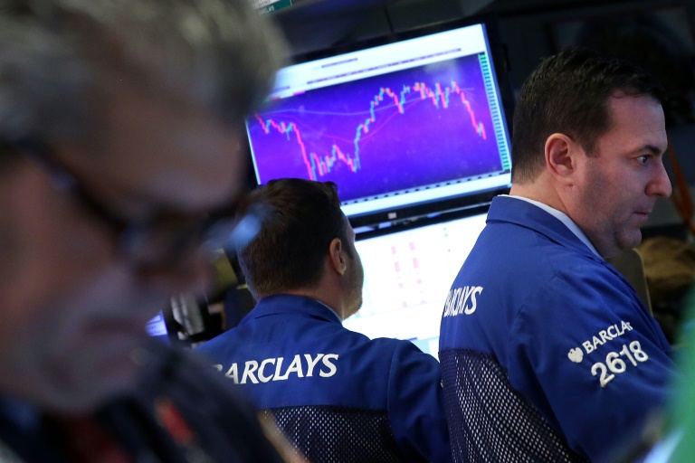 Getty  AFP  Spencer Platt Traders work on the floor of the New York Stock Exchange