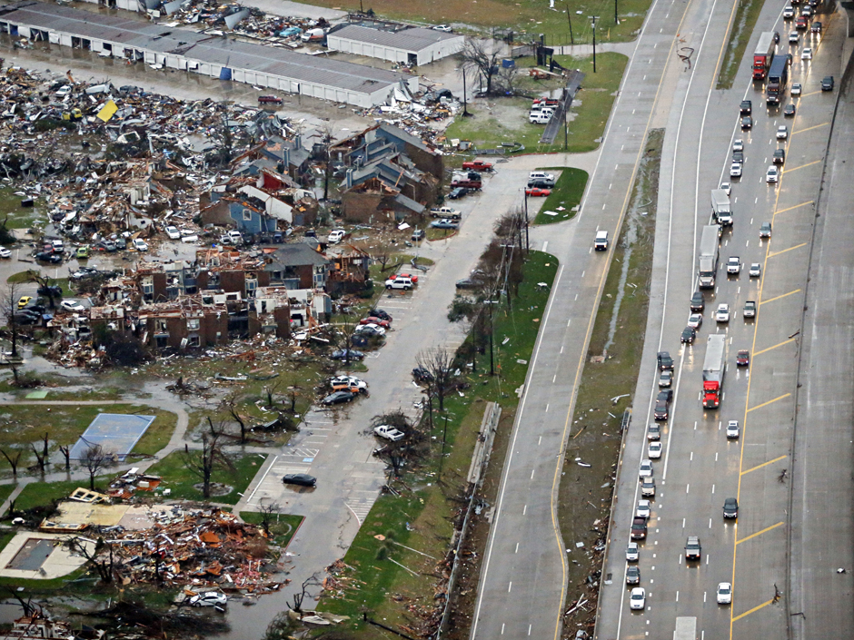 On Sunday Traffic backs up along I-30 near a site of tornado that struck a day earlier in Garland Texas