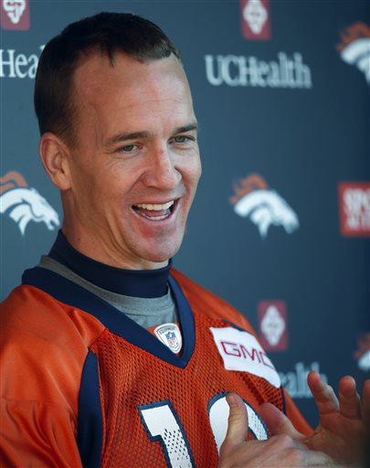 Denver Broncos quarterback Peyton Manning jokes with reporters after an NFL football practice at the team's headquarters Thursday Jan. 28 2016 in Englewood Colo. The Broncos are preparing to face the Carolina Panthers in Super Bowl 50 on Sunday