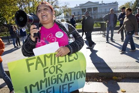 Ingrid Vaca originally of Bolivia speaks during rally for immigration reform in front of the White House in Washington. The Supreme Court has agreed to an election-year review of President Barack Obama’s executi