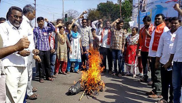 Left parties burning an effigy of Union Ministers in Nizamabad on Friday