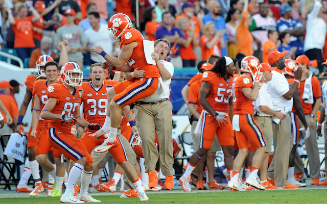 Andy Teasdall and Dabo Swinney celebrate after a perfectly executed fake punt pass