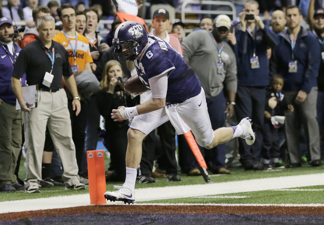 TCU quarterback Bram Kohlhausen runs for a touchdown against Oregon during the third overtime of the Alamo Bowl NCAA college football game Saturday Jan