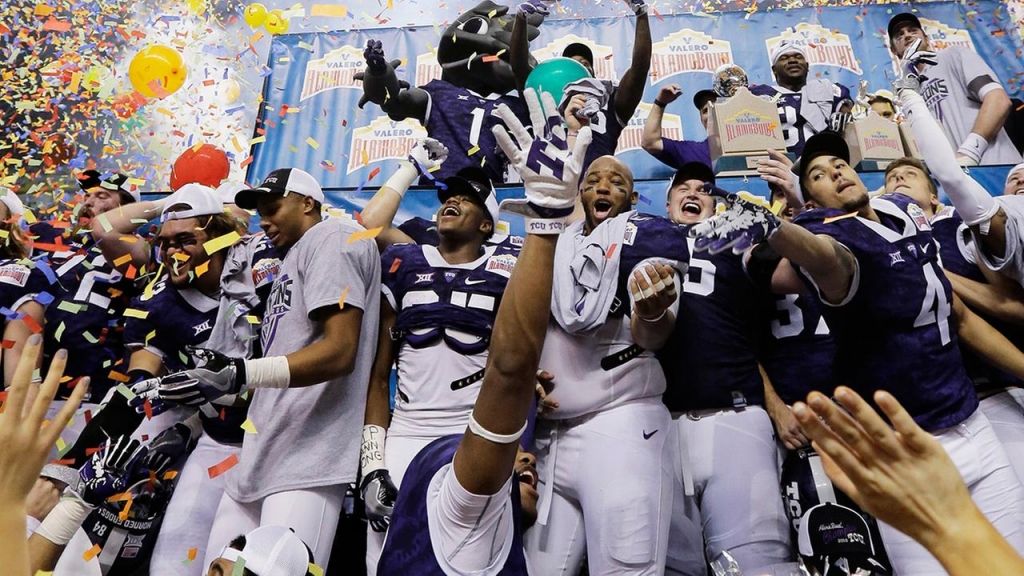 TCU players celebrate their win in the Alamo Bowl NCAA college football game against Oregon