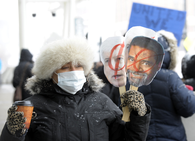 Pasteur Elementary teacher Rochelle Hicks 42 of Southfield and other teachers from Detroit area schools protest outside the Cobo Center Wednesday Jan. 2