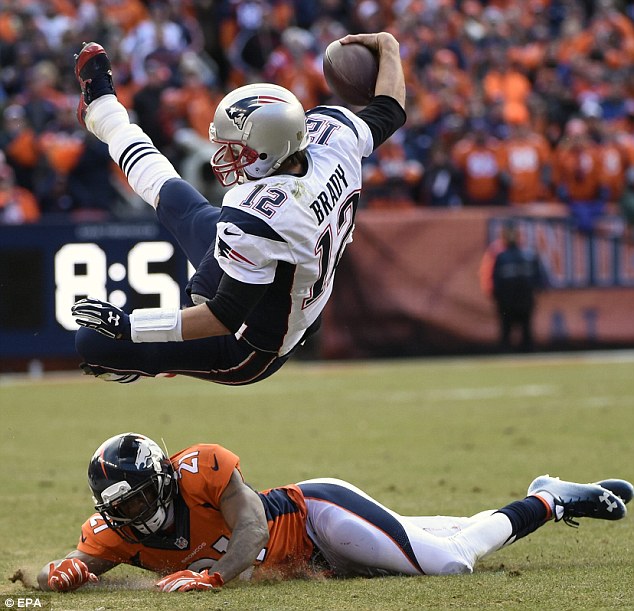 The Brady crunch Tom being tackled by Denver Broncos cornerback Aqib Talib during Sunday's game