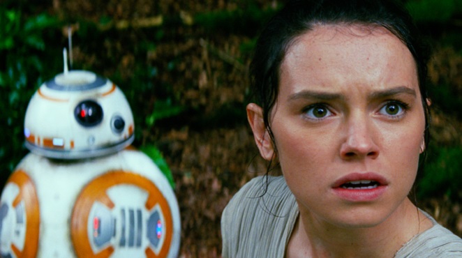 Lucasfilm shows Daisy Ridley right as Rey and BB-8 in a scene from the film'Star Wars The Force Awakens' directed by J.J. Abrams. The movie opens in U.S. theaters on Friday Dec. 18 2015. (Film Frame  Disney  Lucasfil