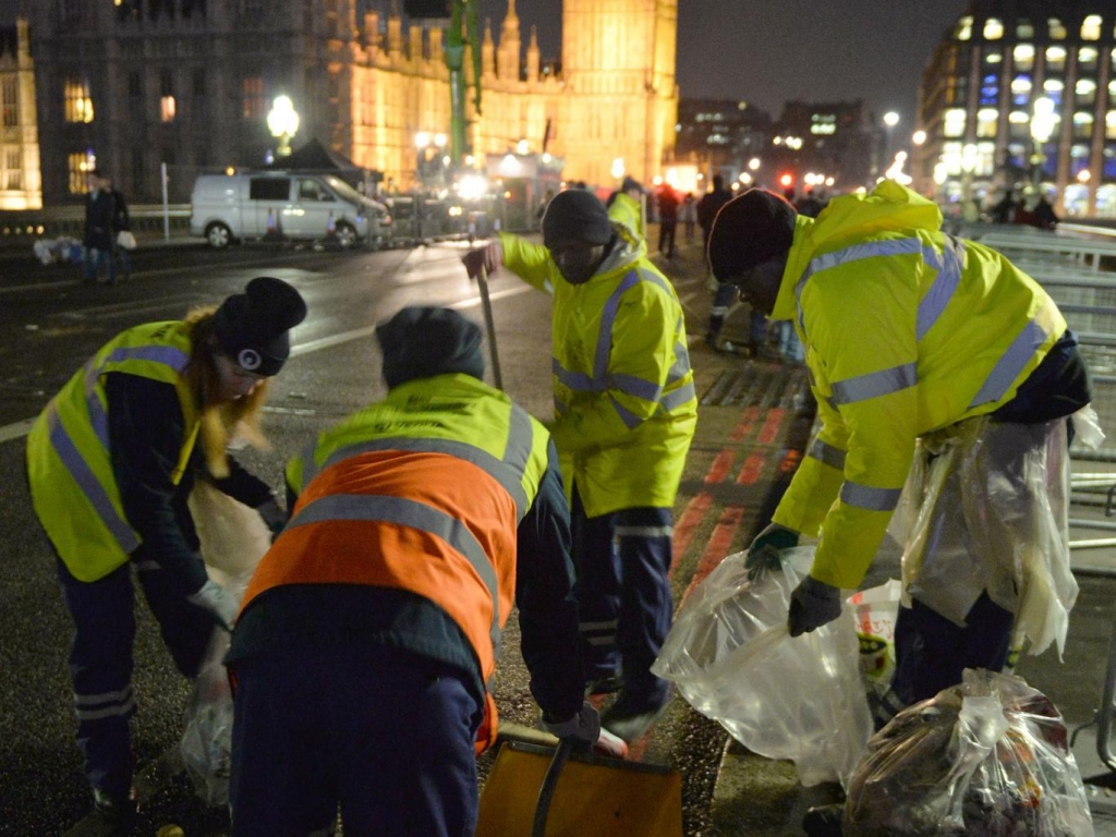 The clean-up begins in central London after the New Year celebration fireworks. PA