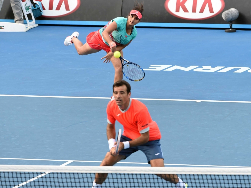 The pair of Sania Mirza and Ivan Dodig during their mixed doubles semifinal match against Elena Vesnina and Bruno Soares