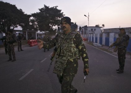 An Indian army officer asks media crew to move aside inside the Indian Air Force base at Pathankot in Punjab India