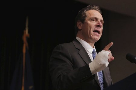 New York Governor Andrew Cuomo speaks at a union rally for higher minimum wages in New York