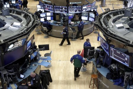 Traders work on the floor of the New York Stock Exchange