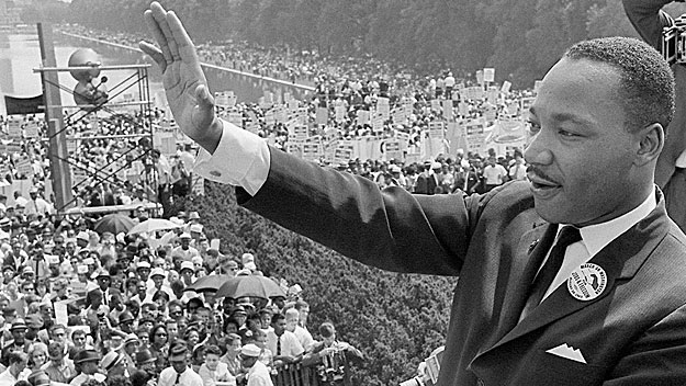 Dr. Martin Luther King waves to supporters on the Mall in Washington DC during the 'March on Washington&#039