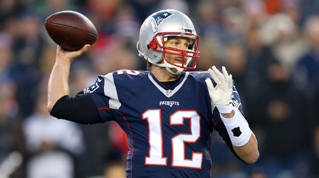 Tom Brady #12 of the New England Patriots looks to pass in the first half against the Kansas City Chiefs during the AFC Divisional Playoff Game