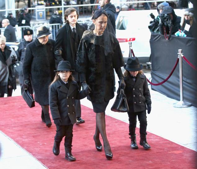 Celine Dion enters the Notre Dame Basilica with her children and mother for Rene Angelil's funeral service Friday