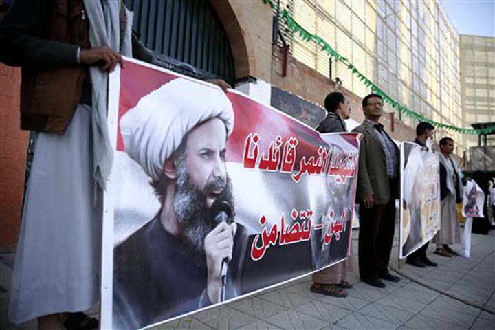 Shiite rebels known as Houthis hold posters of late Shiite cleric Nimr al-Nimr who was executed in Saudi Arabia during an anti Saudi protest outside the Saudi embassy in Sanaa Yemen Thursday Jan. 7 2016