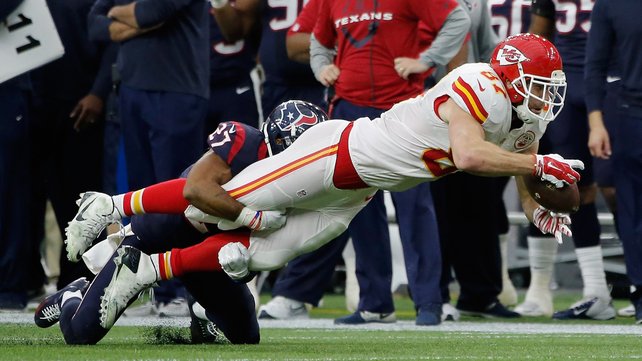 Travis Kelce of the Kansas City Chiefs is tackled by Huston Texans&#39 Quintin Demps