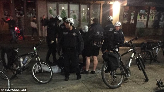 Texas Christian University quarterback Trevone Boykin handcuffed and laying on the sidewalk after he was wrestled to the ground by police