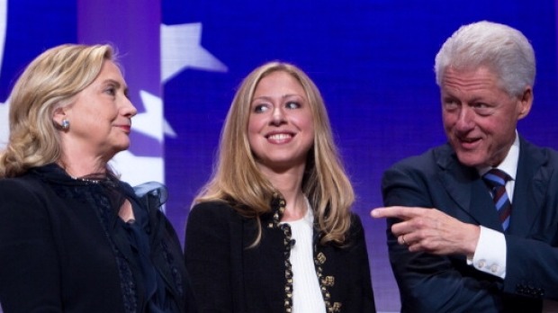 Former US President Bill Clinton on stage with his wife Hillary Rodham Clinton former US Secretary of State and their daughter Chelsea Clinton in 2011