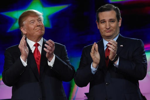 Republican presidential candidates Donald Trump and Sen. Ted Cruz applaud as they are introduced during the CNN presidential debate at The Venetian Las Vegas on Dec. 15 2015 in Las Vegas Nev