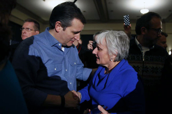 Republican presidential candidate Ted Cruz talks with an audience member Wednesday Jan. 27 2016 in West Des Moines Iowa