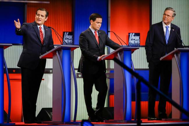 Republican presidential candidate Sen. Ted Cruz R-Texas left answers a question as Sen. Marco Rubio R-Fla. center listens and former Florida Gov. Jeb Bush right looks on during a Republican presidential primary debate Thursday Jan. 28 2016