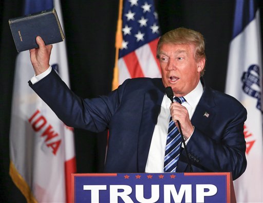 Republican presidential candidate Donald Trump holds up his Bible during a campaign stop in Council Bluffs Iowa Tuesday Dec. 29 2015