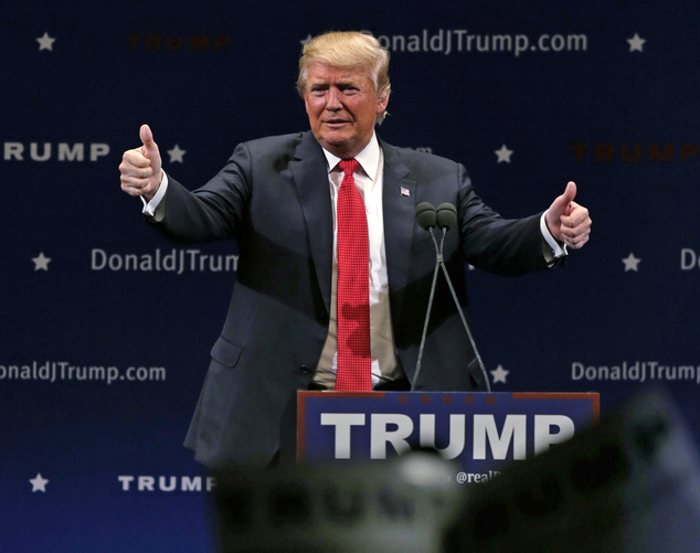 Republican presidential candidate Donald Trump flashes thumbs up after an address to a group of supporters at a campaign stop