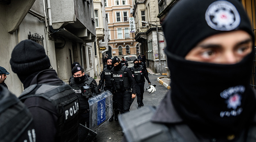 Turkish riot police block the street as Turkish anti-terrorist police officers search the pro-kurdish Peoples&#039 Democratic Party Beyoglu headquarters