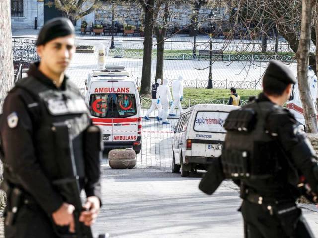 Turkish policemen block access to the Blue Mosque after the blast