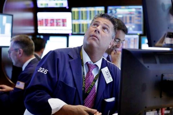 Trader William Mc Inerney works on the floor of the New York Stock Exchange Monday Aug. 24 2015. U.S. investors woke up to a serious jolt Monday when the Dow Jones industrial average tumbled 1,000 points minutes after the market opened in a wave of sell